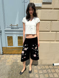 Embroidered black velvet shorts