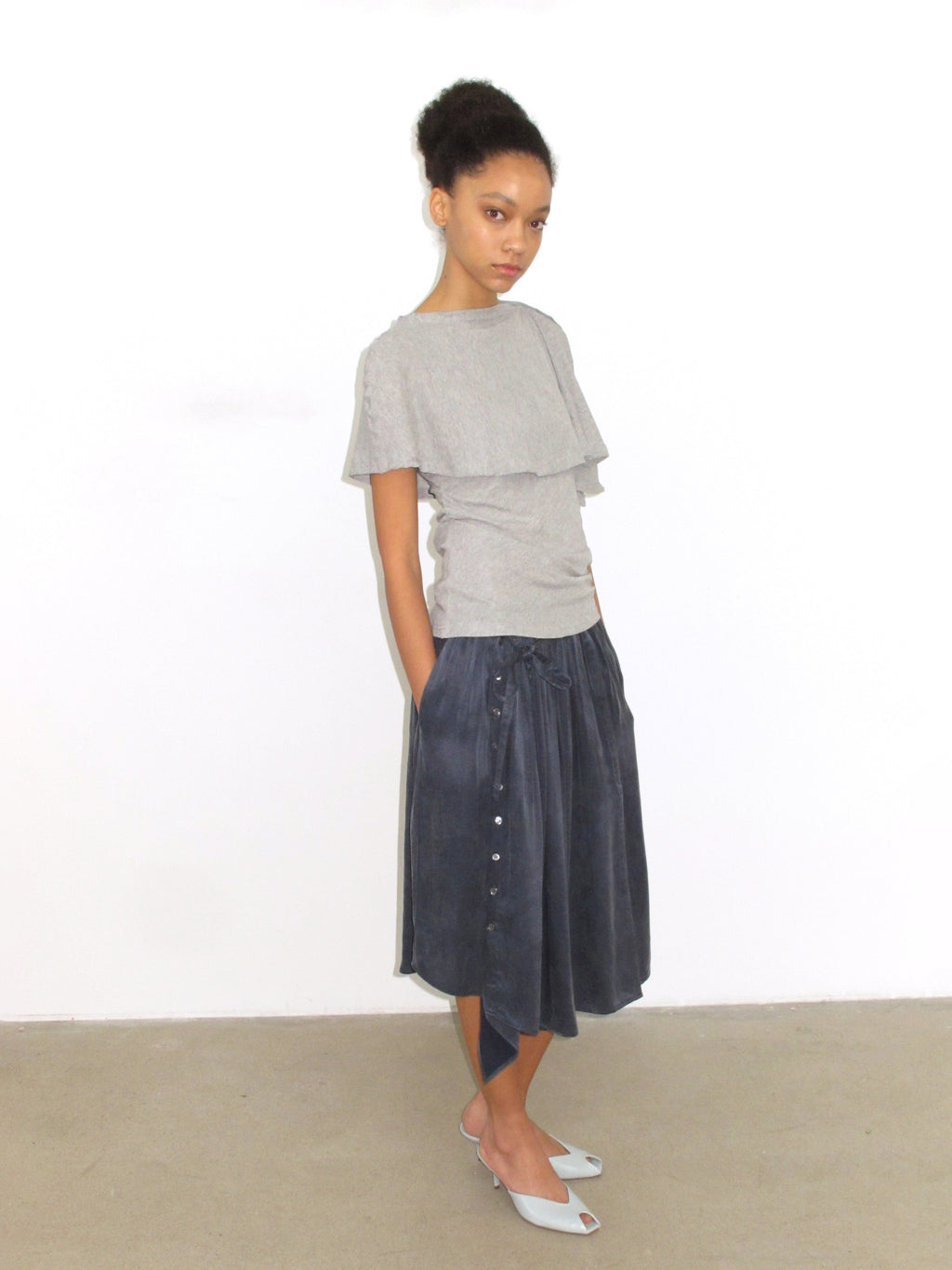 Multi-button high slit drape skirt