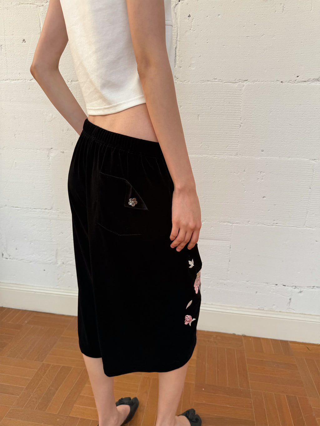 Embroidered black velvet shorts
